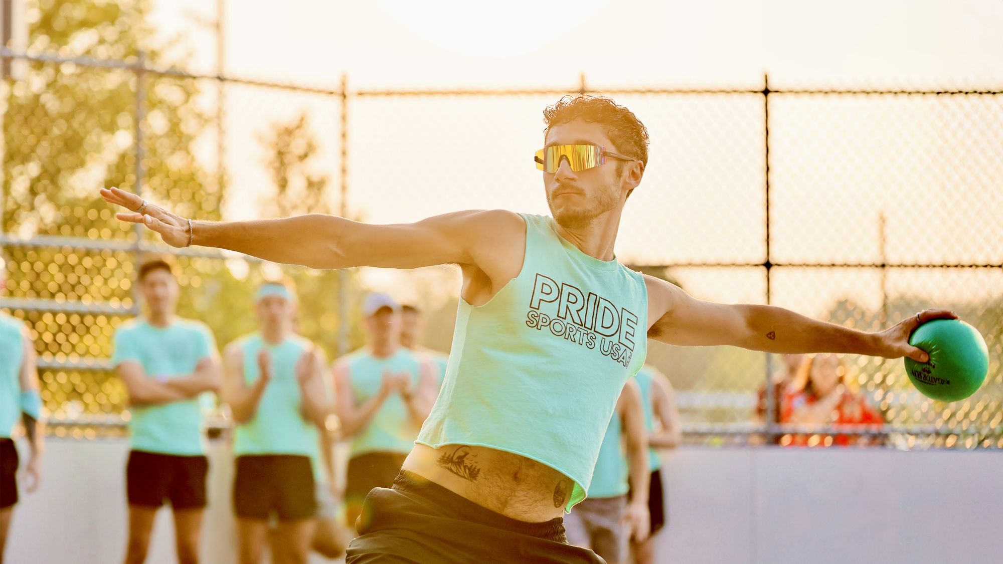 Dodgeball player mid-throw at golden hour