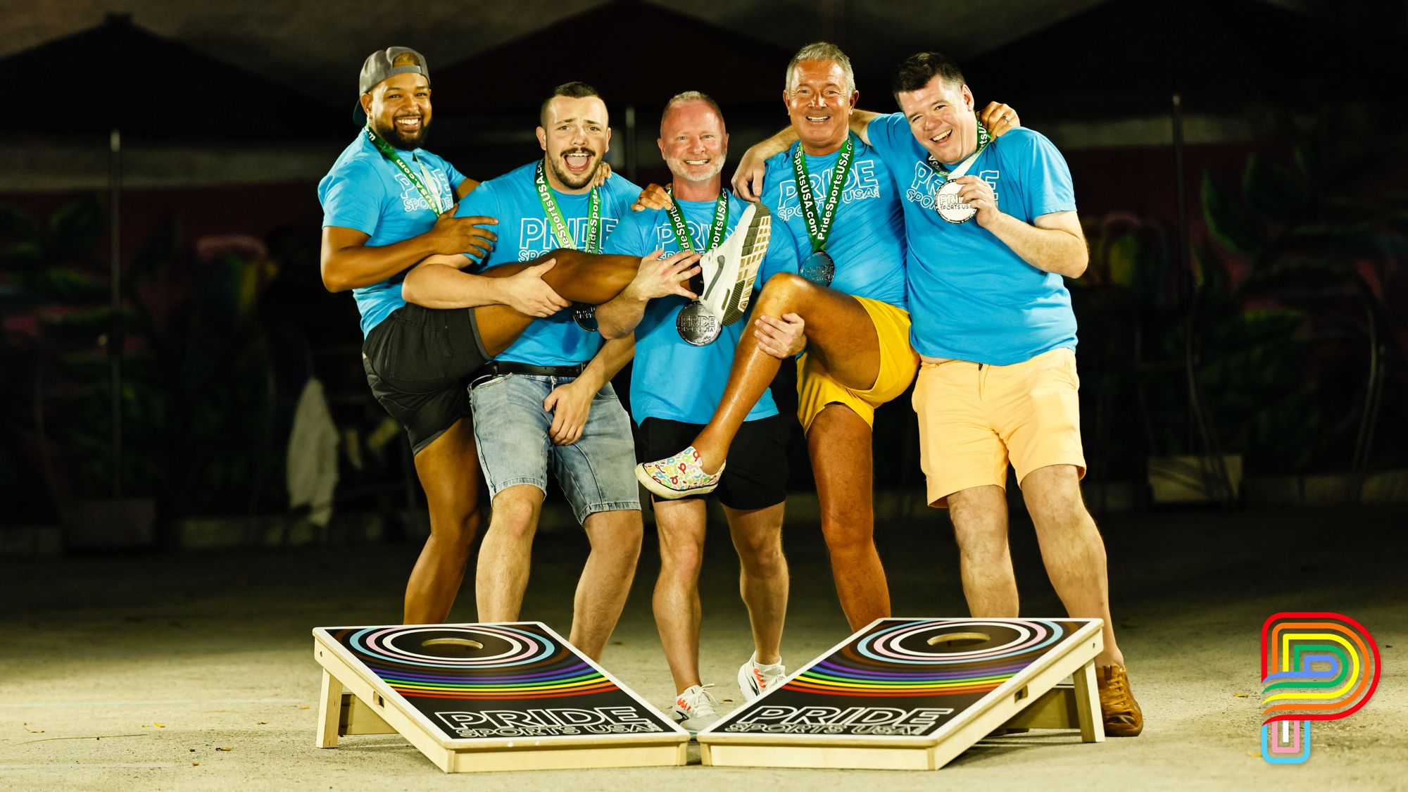 Cornhole champions with medals